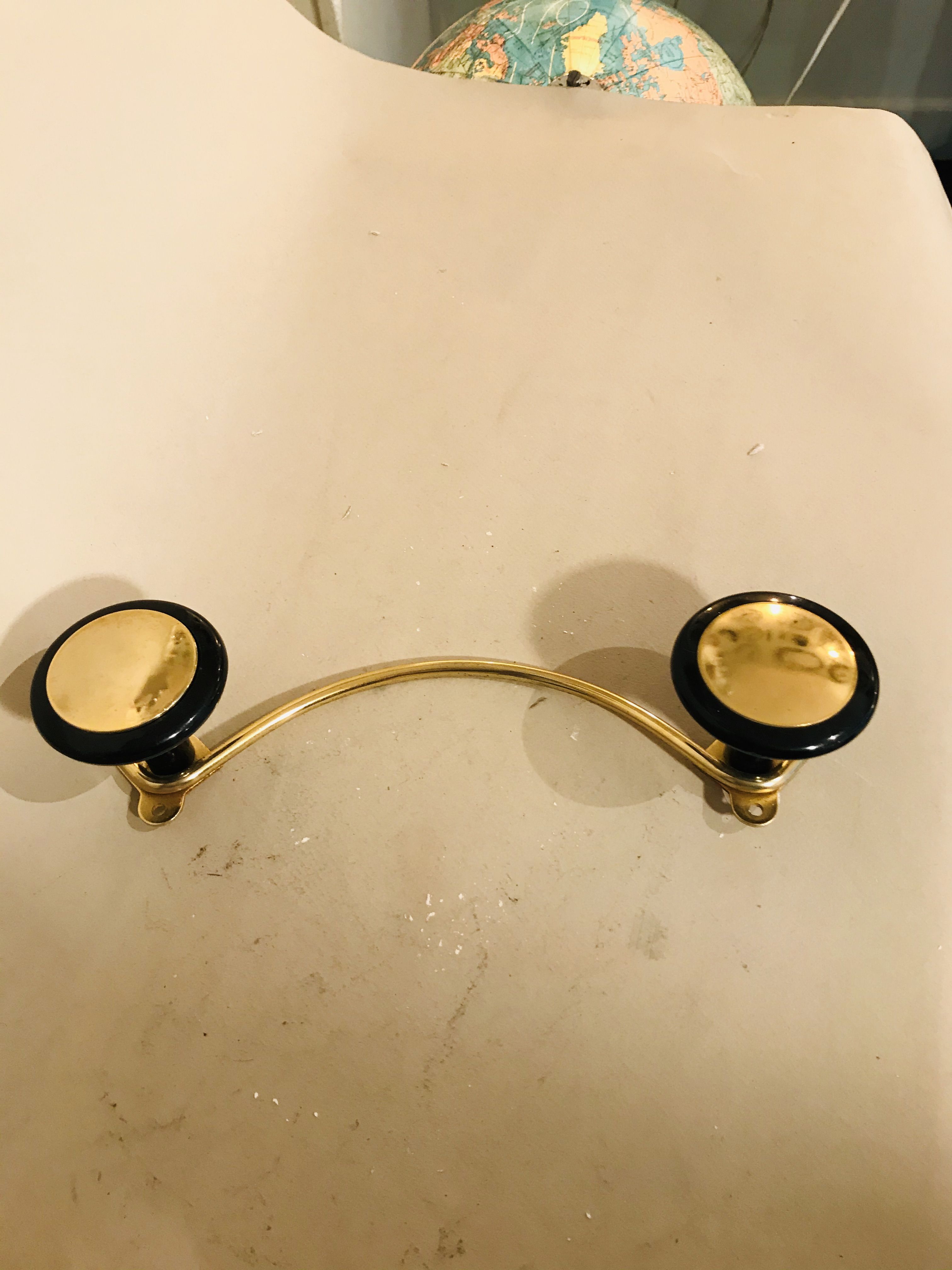Gold and black metal coatrack 1960