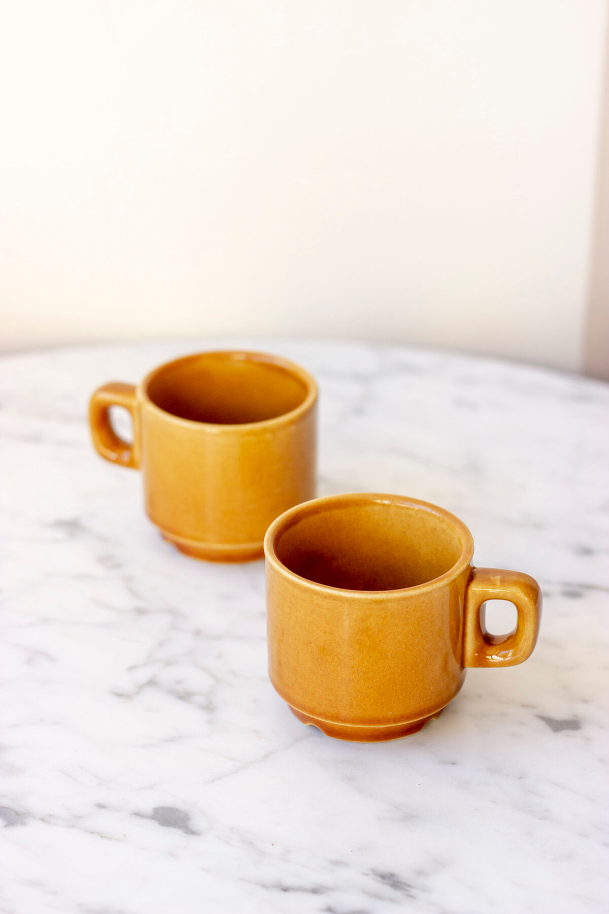 Pair of ochre yellow coffee cups