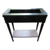 Vintage planter on wheels made of oak, repainted in black.