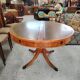 Round Regency dining table in mahogany and green leather with extensions - 20th century