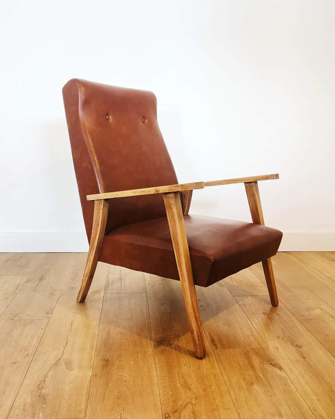 70 armchair in brown skai and wooden structure