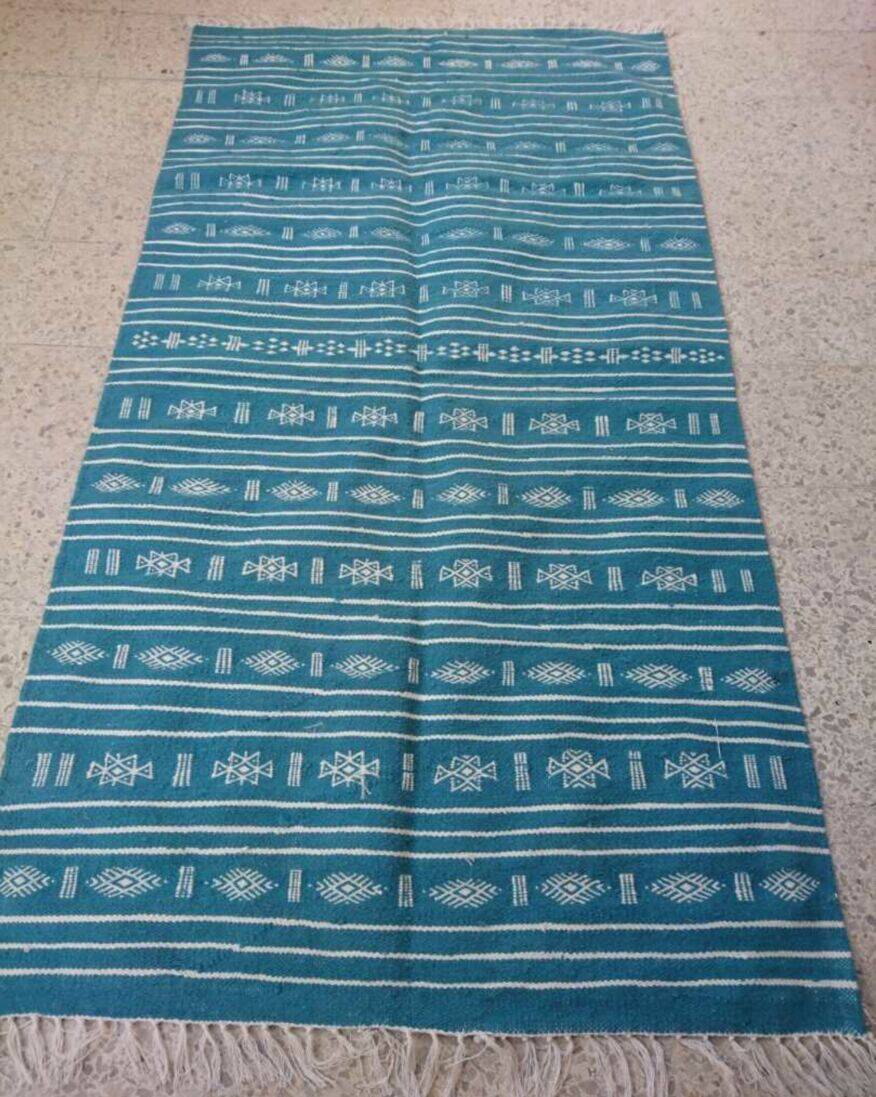 Hand-woven blue and white kilim rug in natural wool