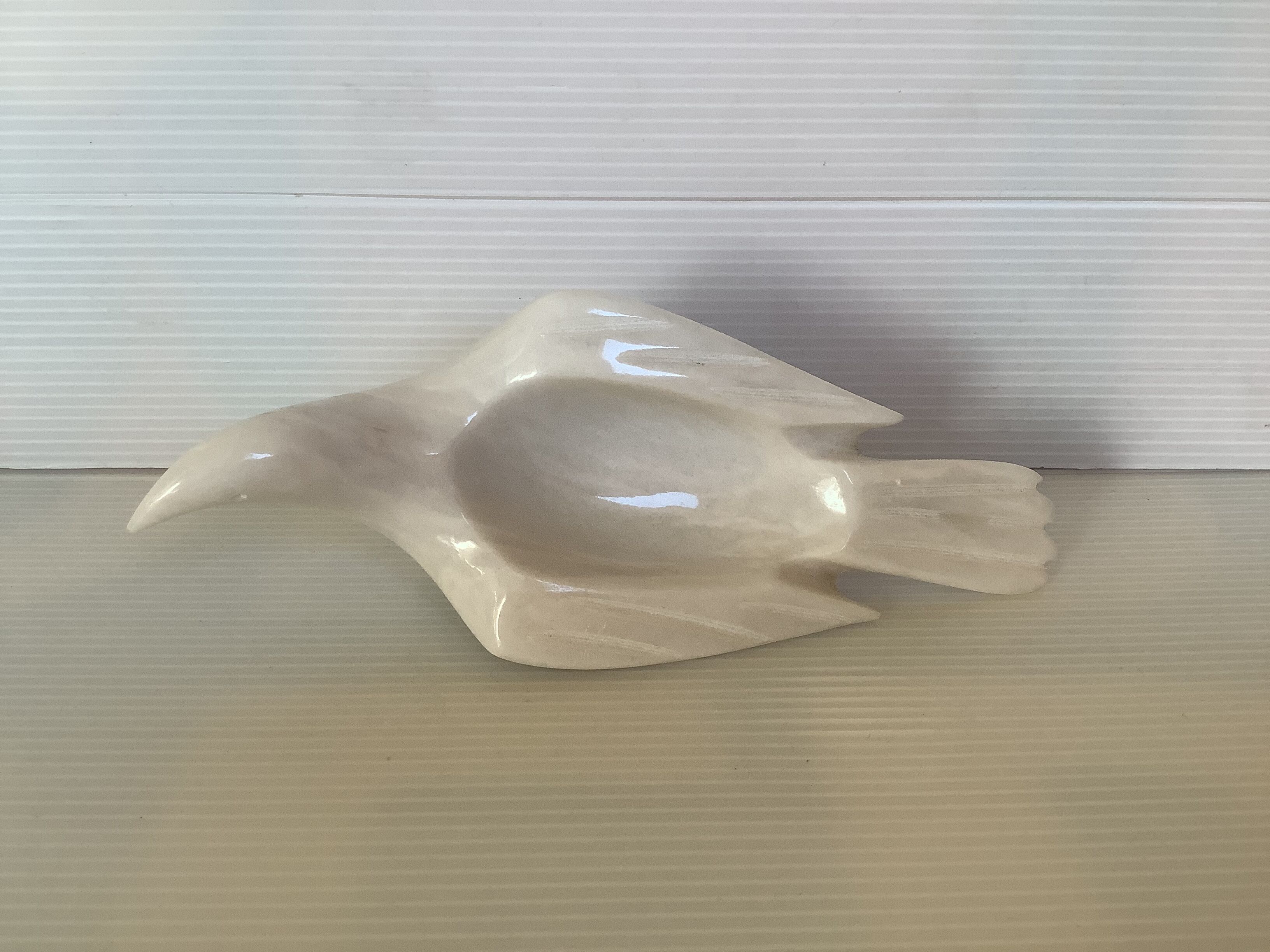 Marble bird empty pocket