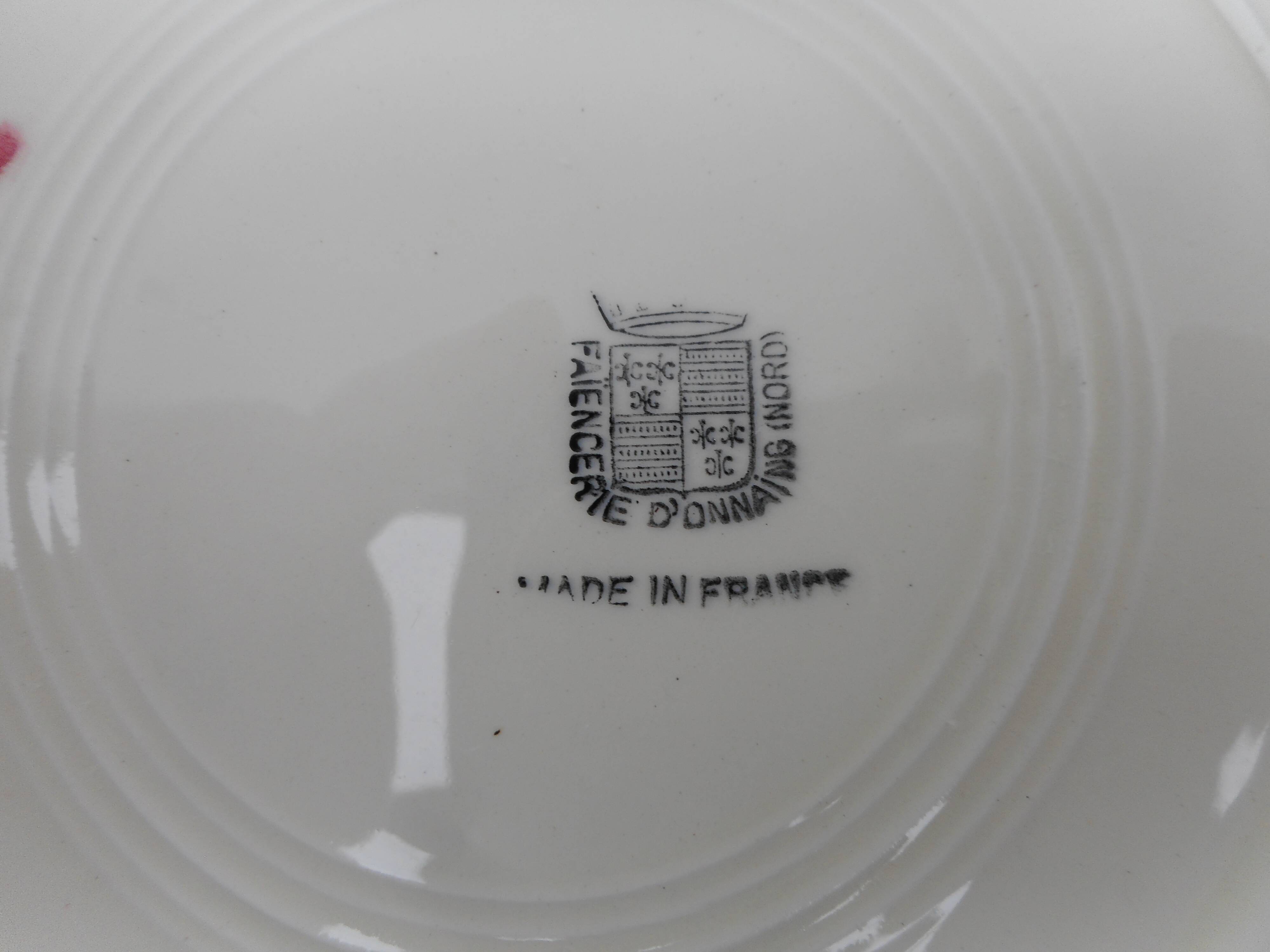 Six hollow earthenware plates