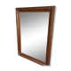 Large wall mirror with an elegant wooden frame.