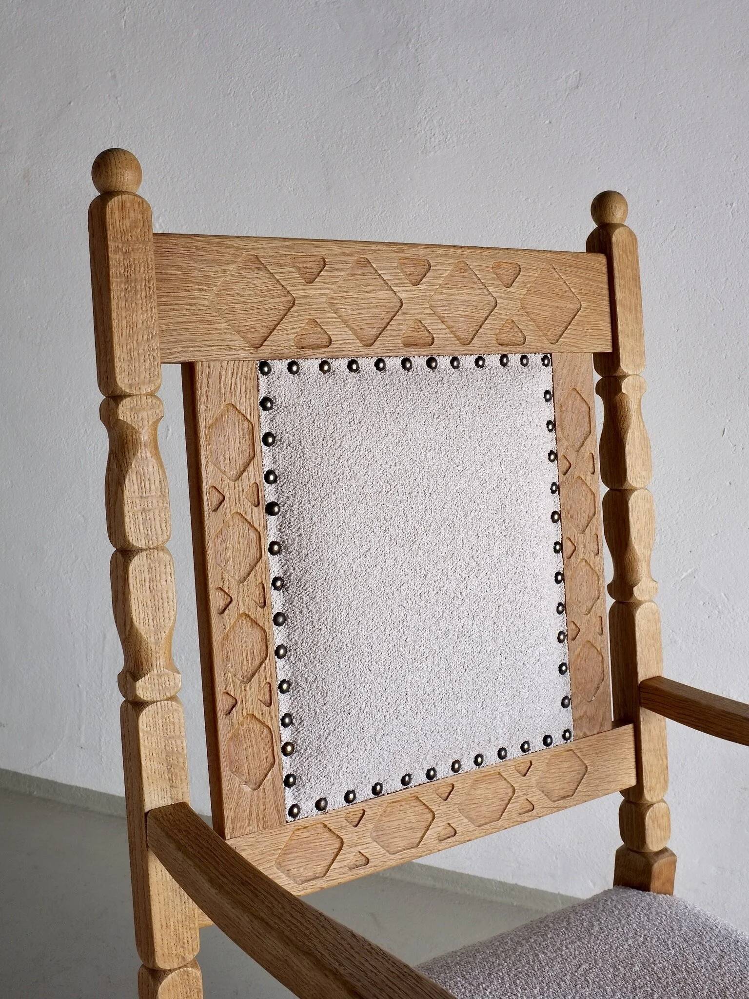 Carved oak armchair by Henning Kjaernulf | Denmark | 1960s