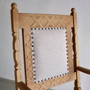 Carved oak armchair by Henning Kjaernulf | Denmark | 1960s
