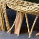 Vintage moss green cocktail chair with fringes.