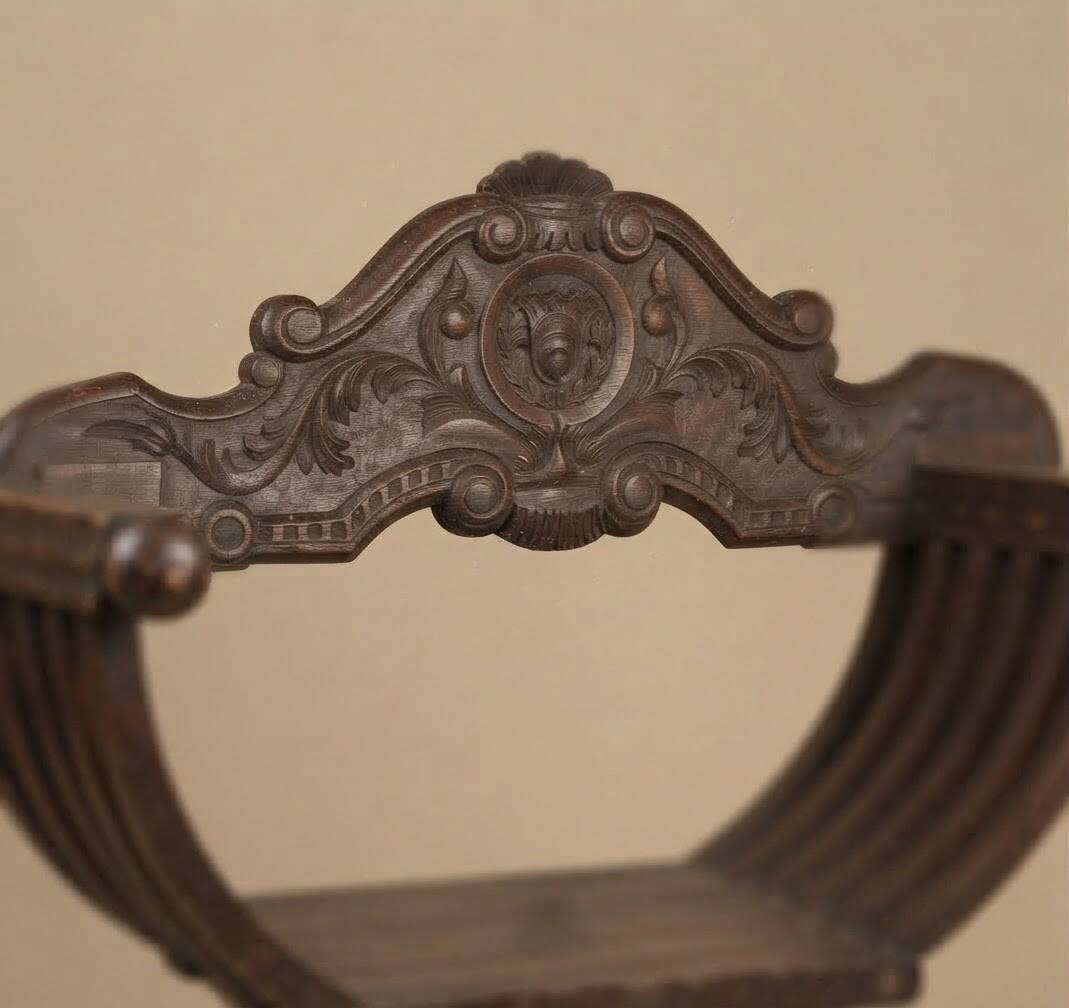Pair of antique Savonarole armchairs in Renaissance style.