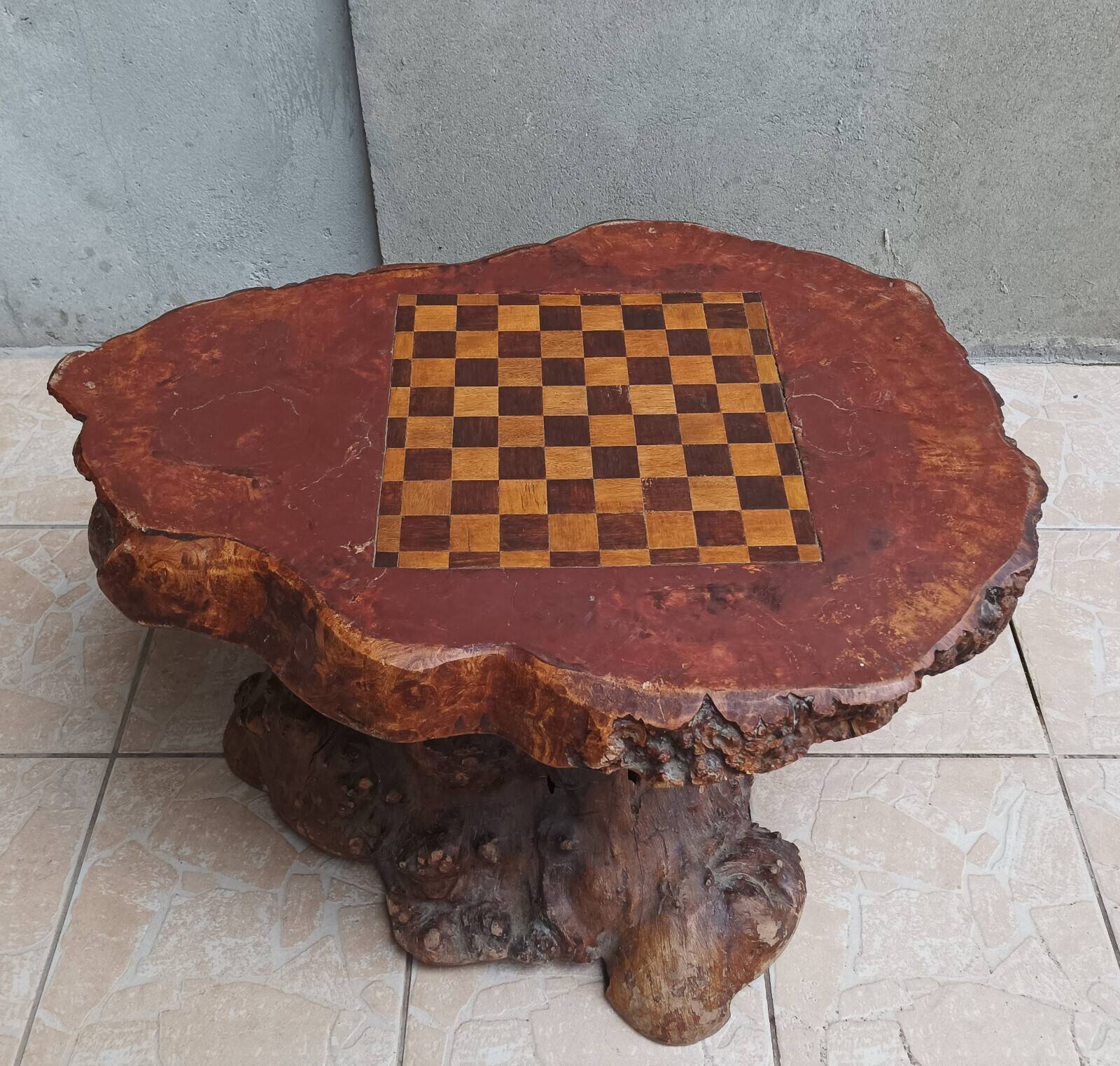 Brutalist chessboard coffee table made from tree stump.