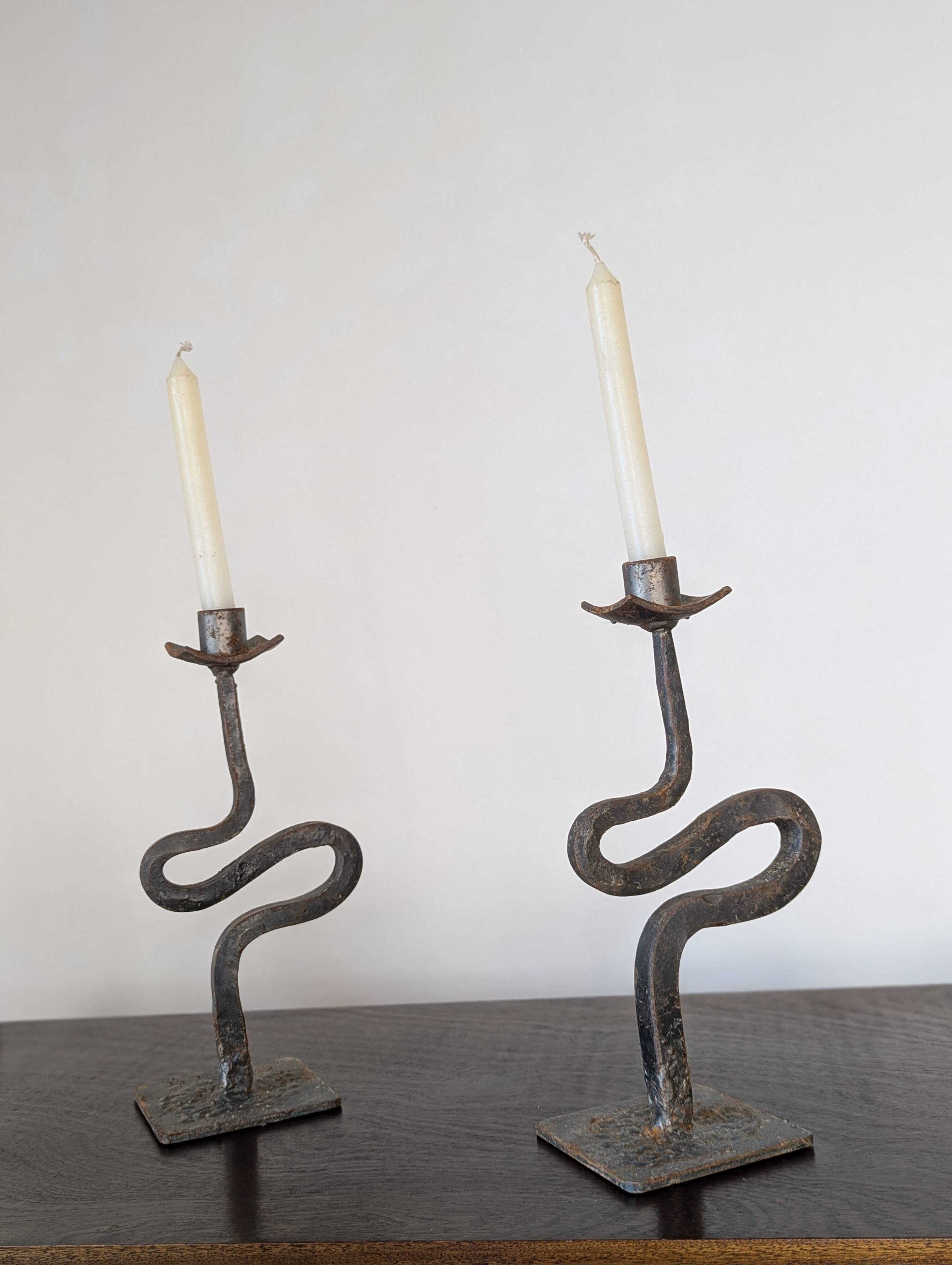 Pair of wrought iron candlesticks