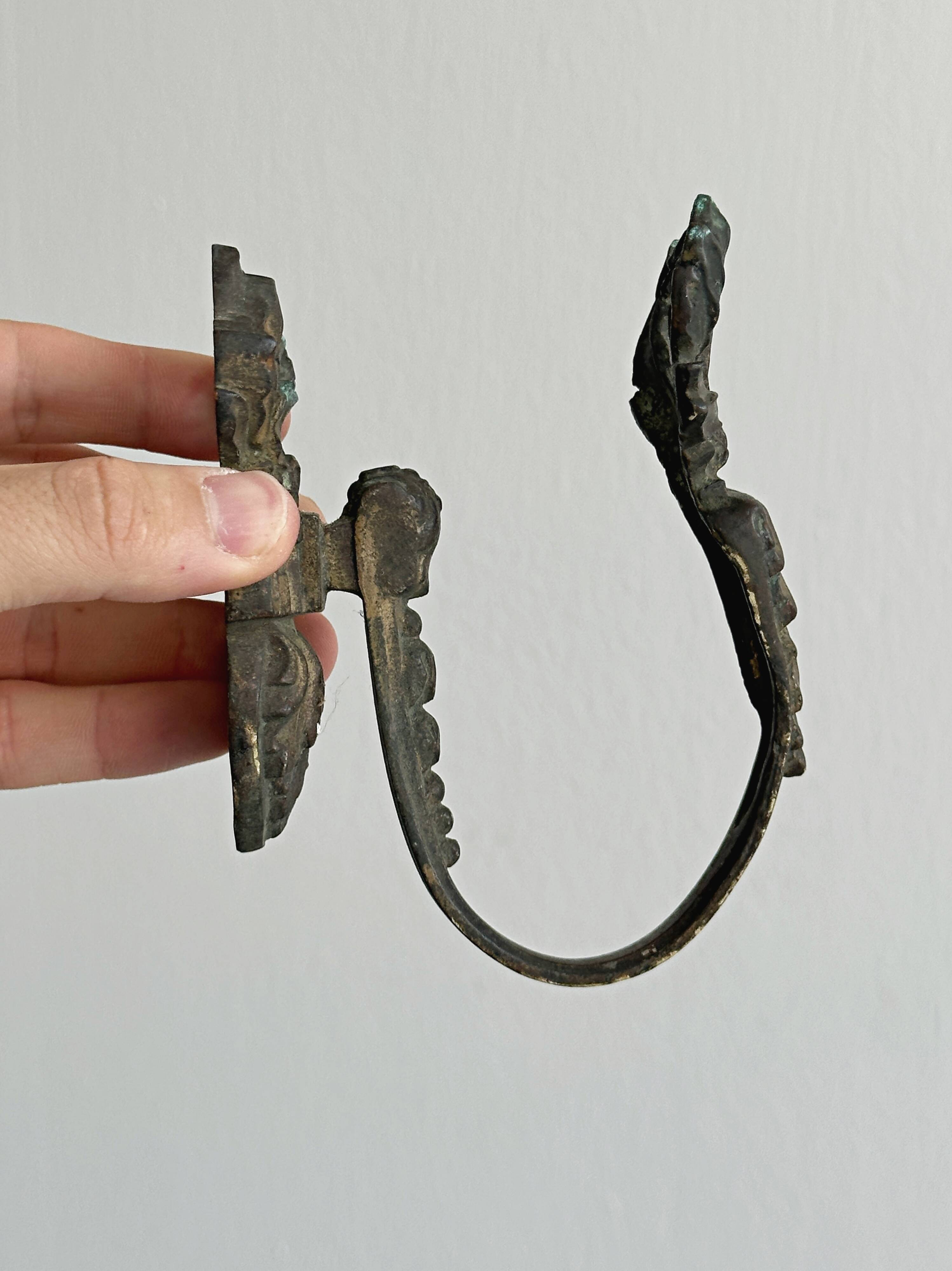 Antique black patinated metal coat hook.