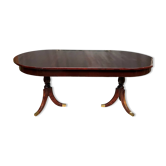 Table à manger de style Empire avec deux éléments coulissants.