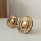 Pair of antique Empire furniture knobs in gilded solid bronze.