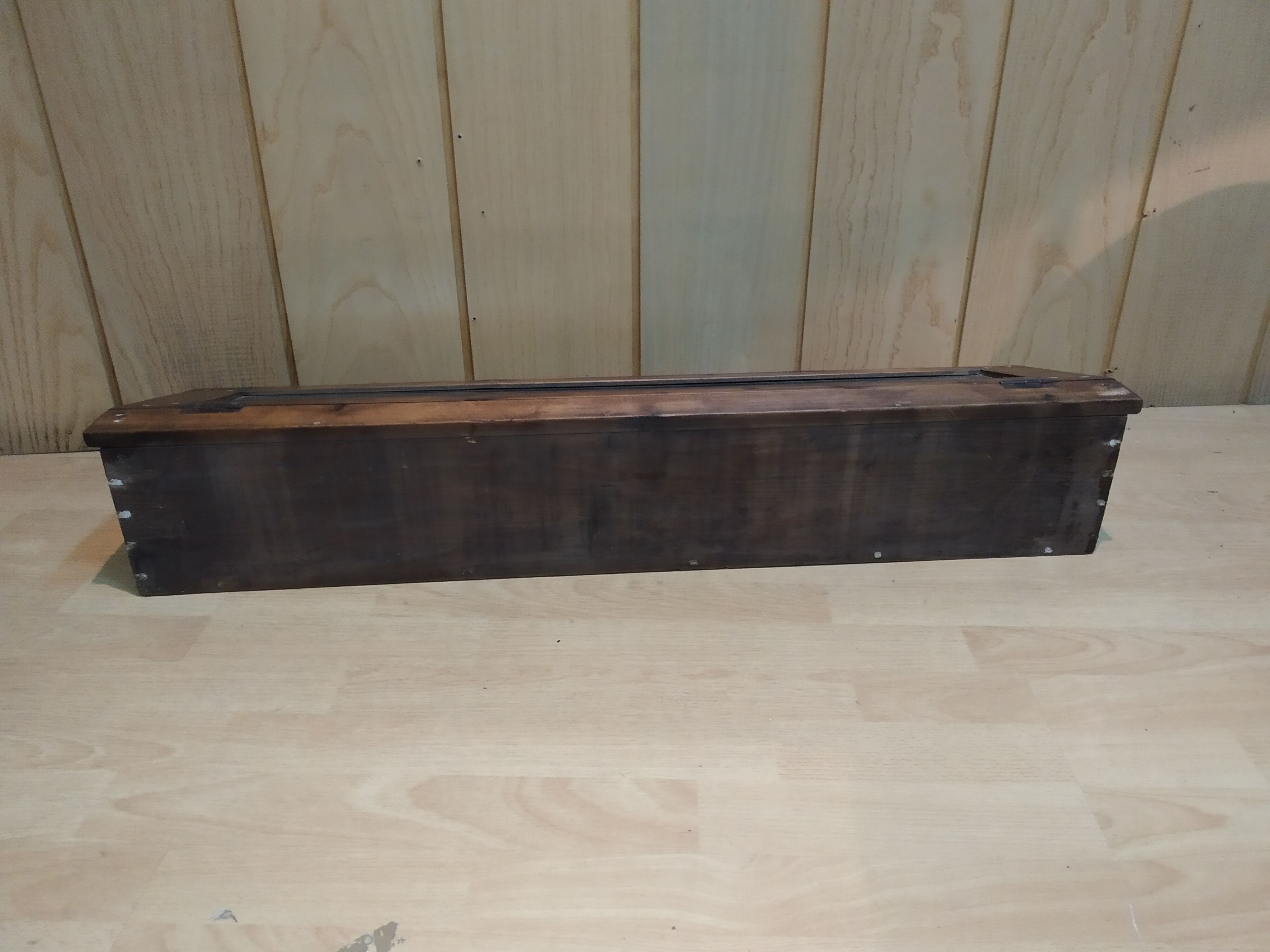 Former wooden display case