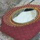 Vintage 1950s sun mirror in gold metal.