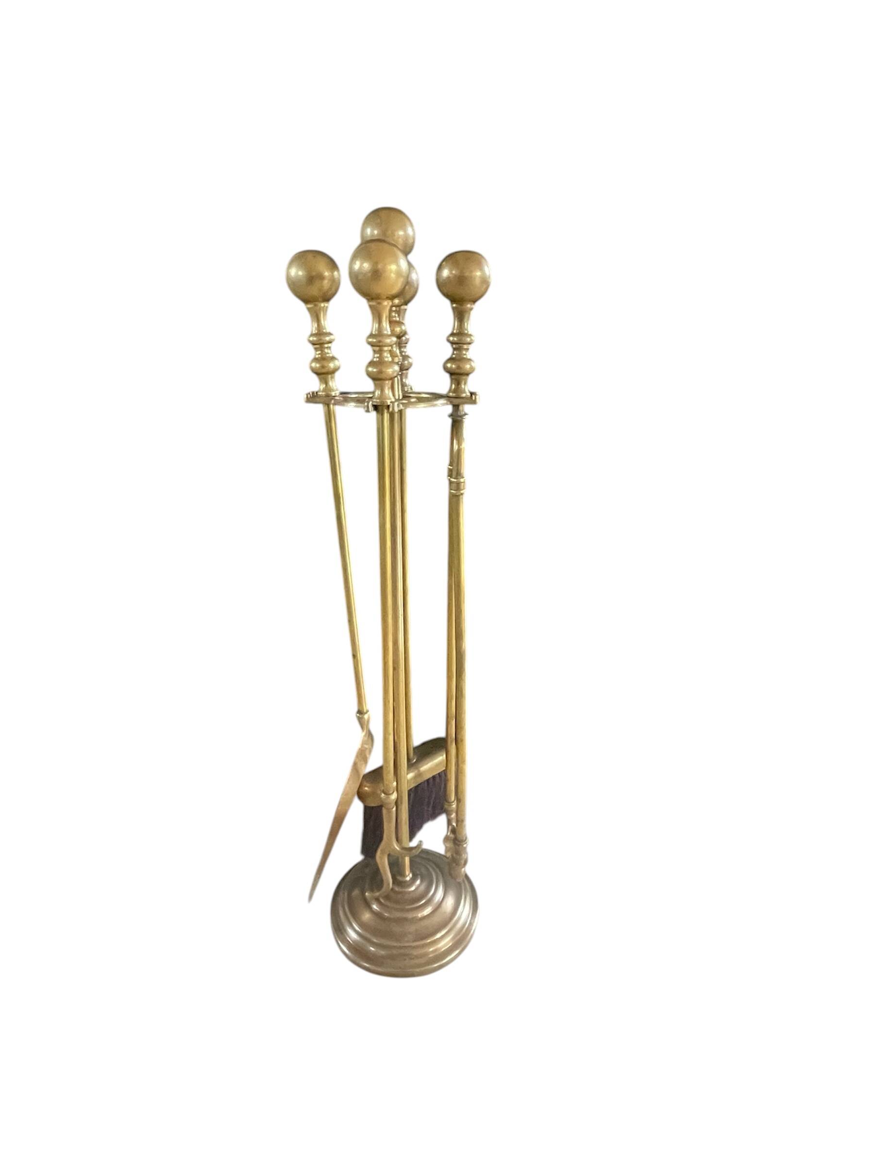 Brass fireplace accessory set with vintage stand