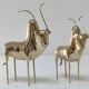 Two stylized zebu with long vintage brass horns