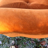 Orange velvet armchair