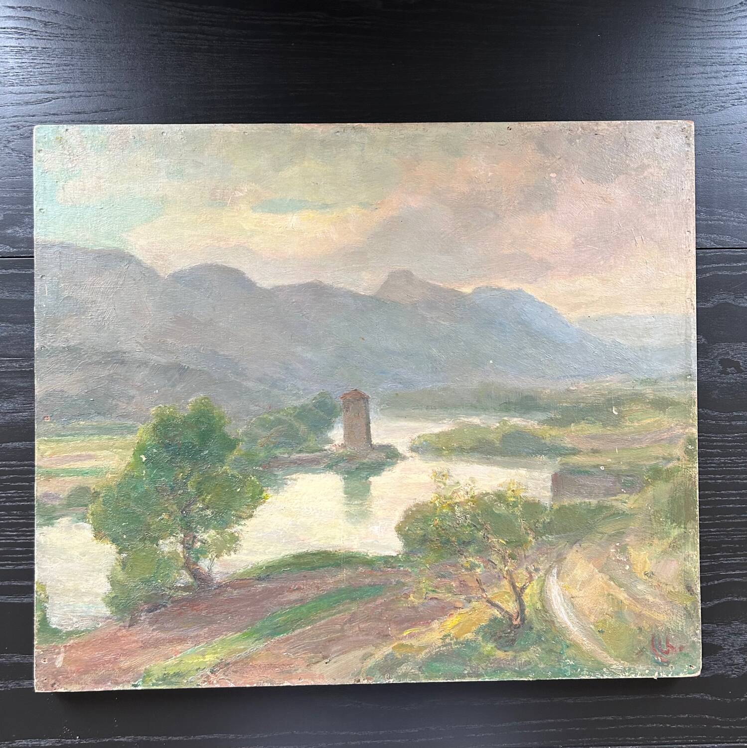 Antique painting of a lake and mountain landscape