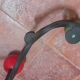 Vintage wall coat rack "Atomic" in wrought iron with multicoloured balls.