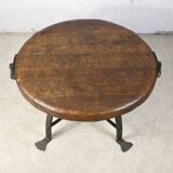 Brutalist round table in wrought iron and wood
