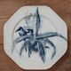 Set of three ironstone plates decorated with birds.