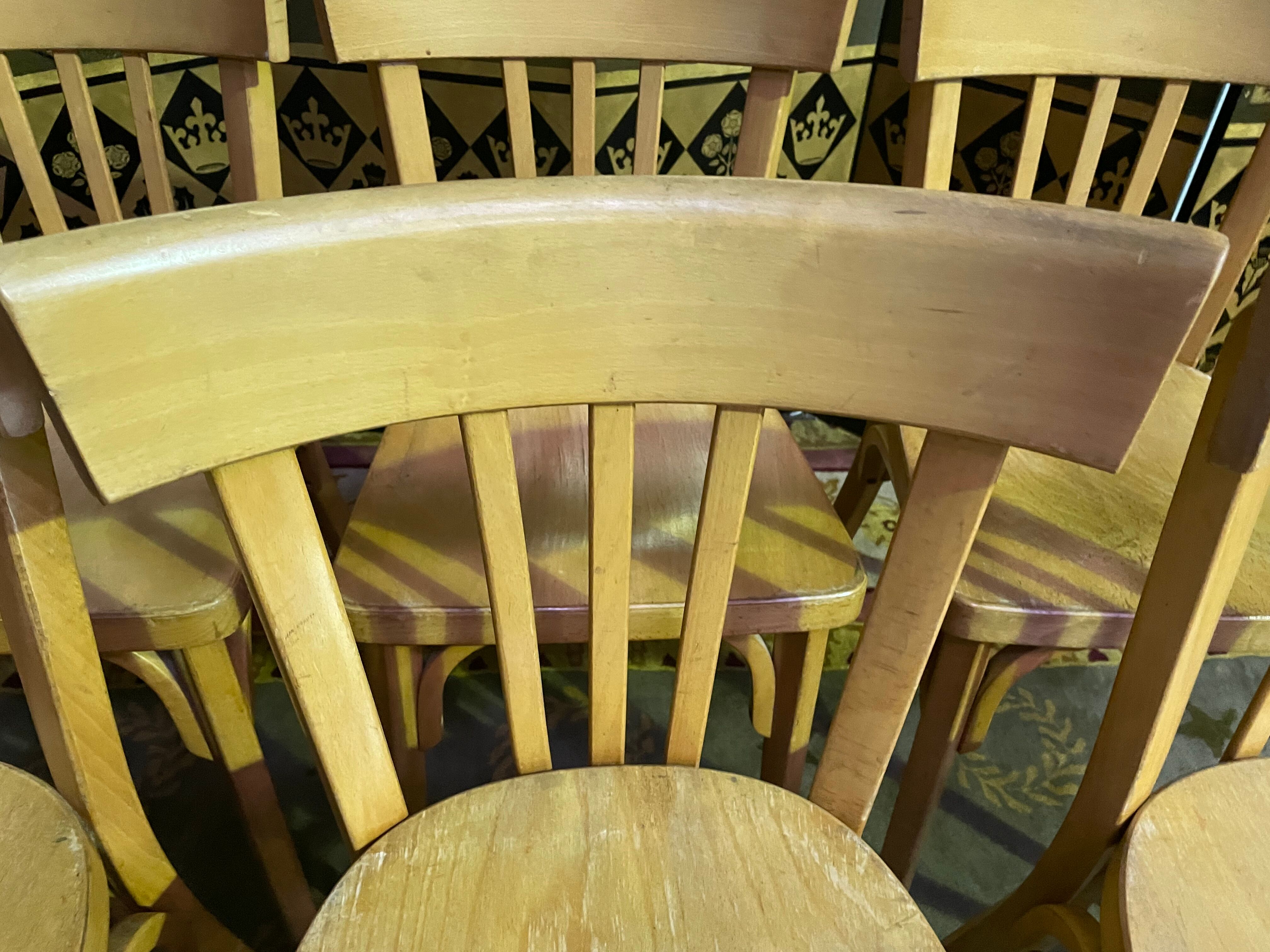 Suite of 6 bistro chairs signed "baumann"