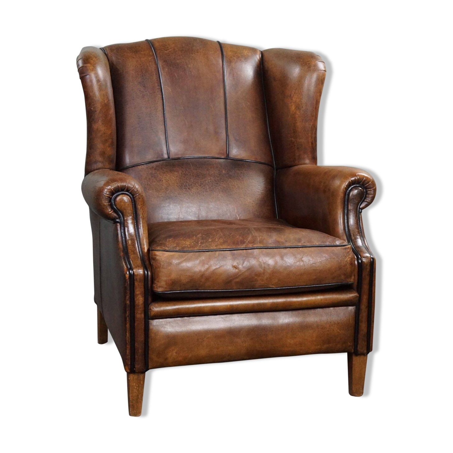 Fauteuil à oreilles en cuir de mouton