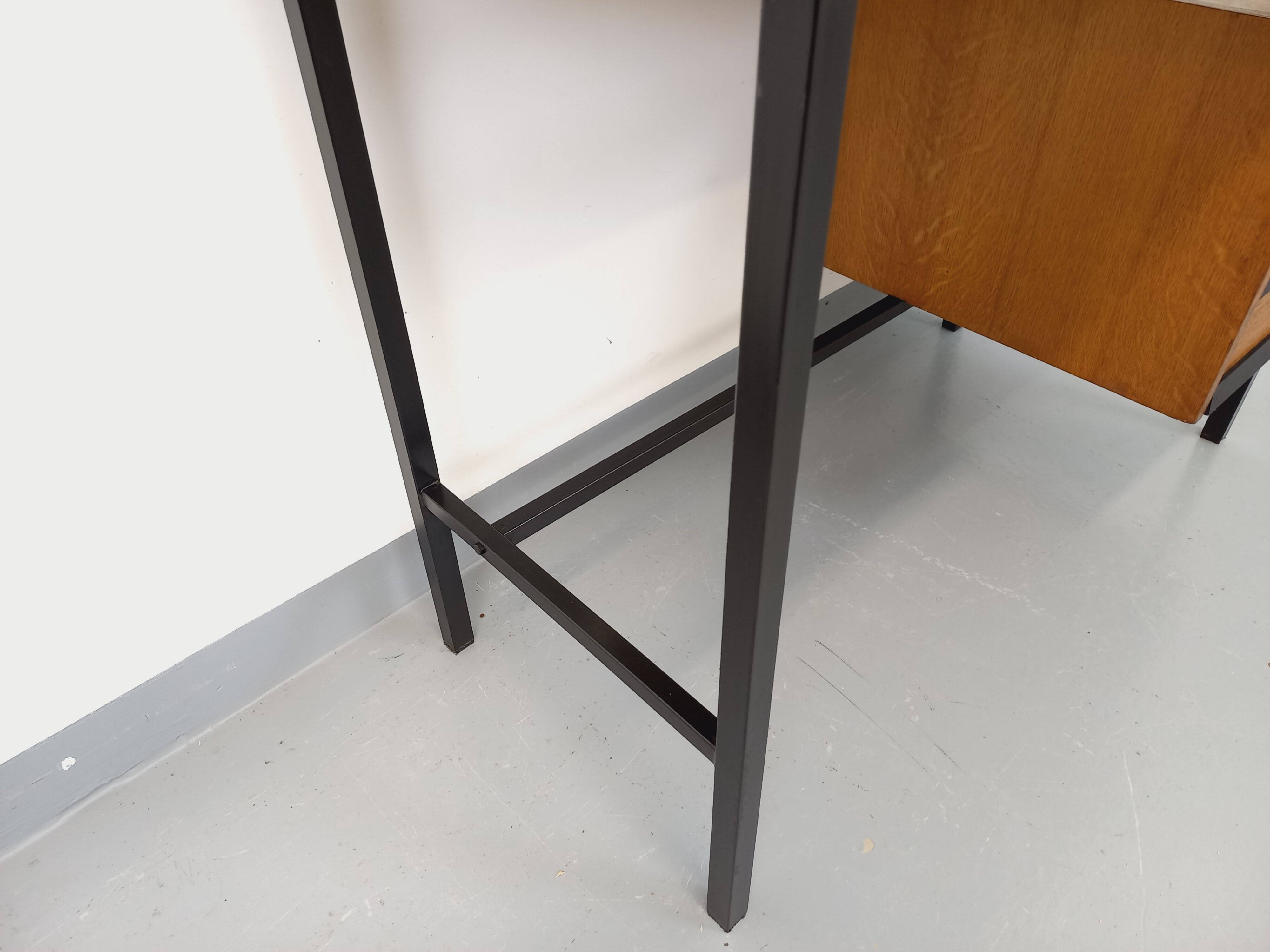 Vintage modernist desk in wood and black metal from the 60s