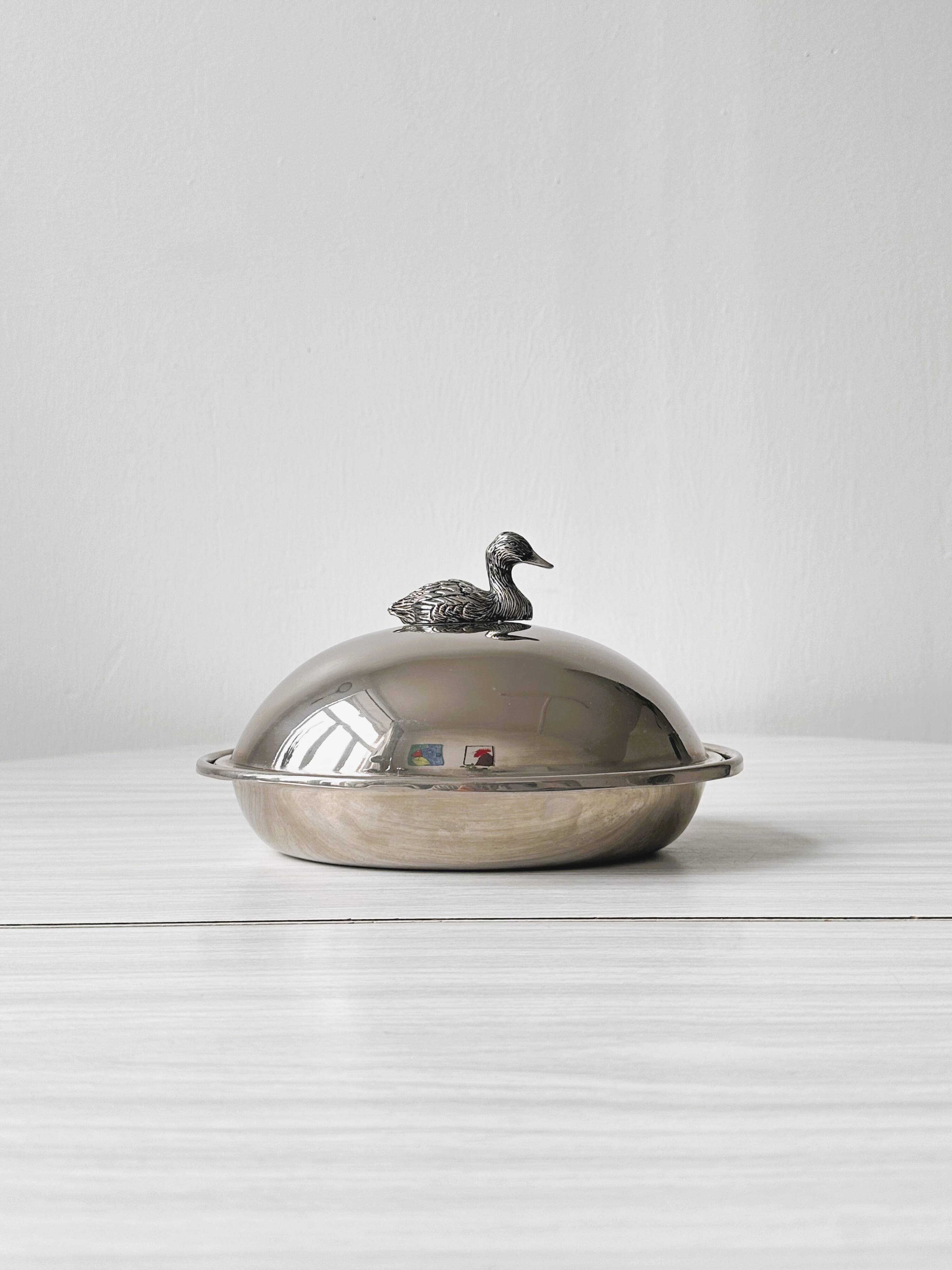 Foie gras display in stainless steel and silver metal.