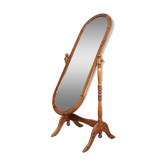 Large psychic mirror on legs with pivoting oval frame.