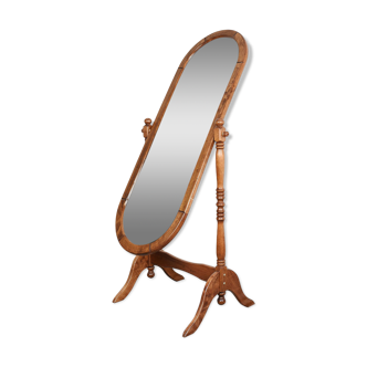 Large psychic mirror on legs with pivoting oval frame.