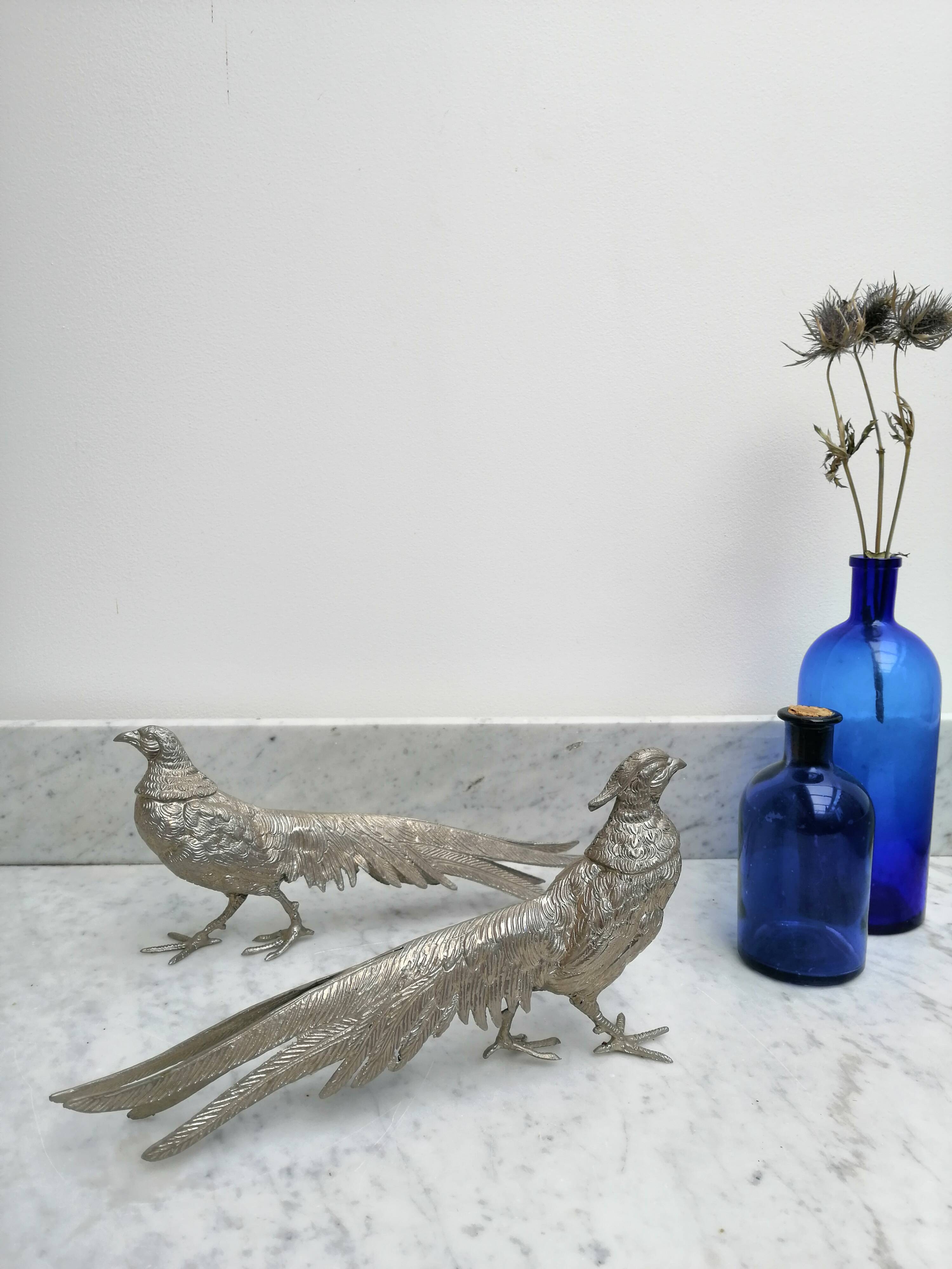Couple of silver metal pheasants