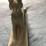 Vintage ceramic lying dog on base