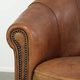 Aged sheepskin clubchair with beautiful vintage patina and comfortable seat