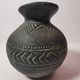 Vintage native american jug pot with geometric patterns in green / gray tones