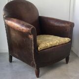 Club armchair in studded leather - early twentieth century