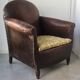 Club armchair in studded leather - early twentieth century