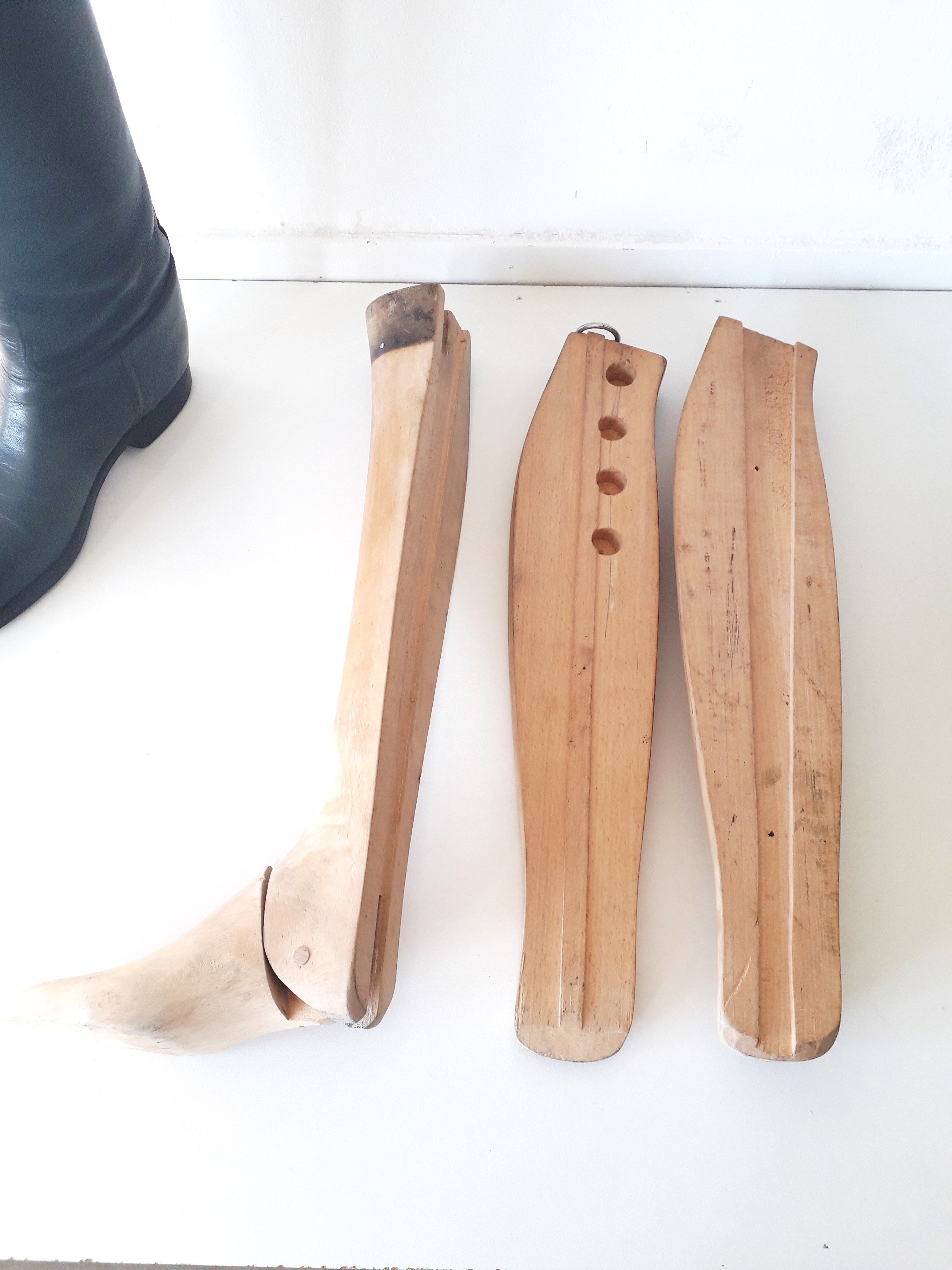 Old wooden shoe trees and their vintage leather rider boots. 1950