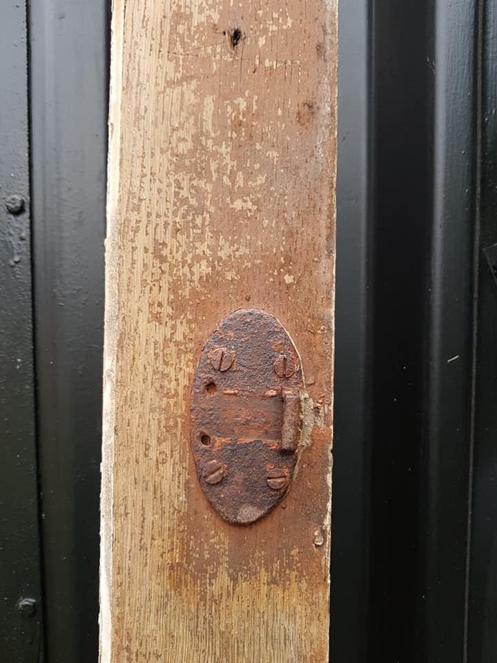 Ancient paneled solid oak door with 3 windows