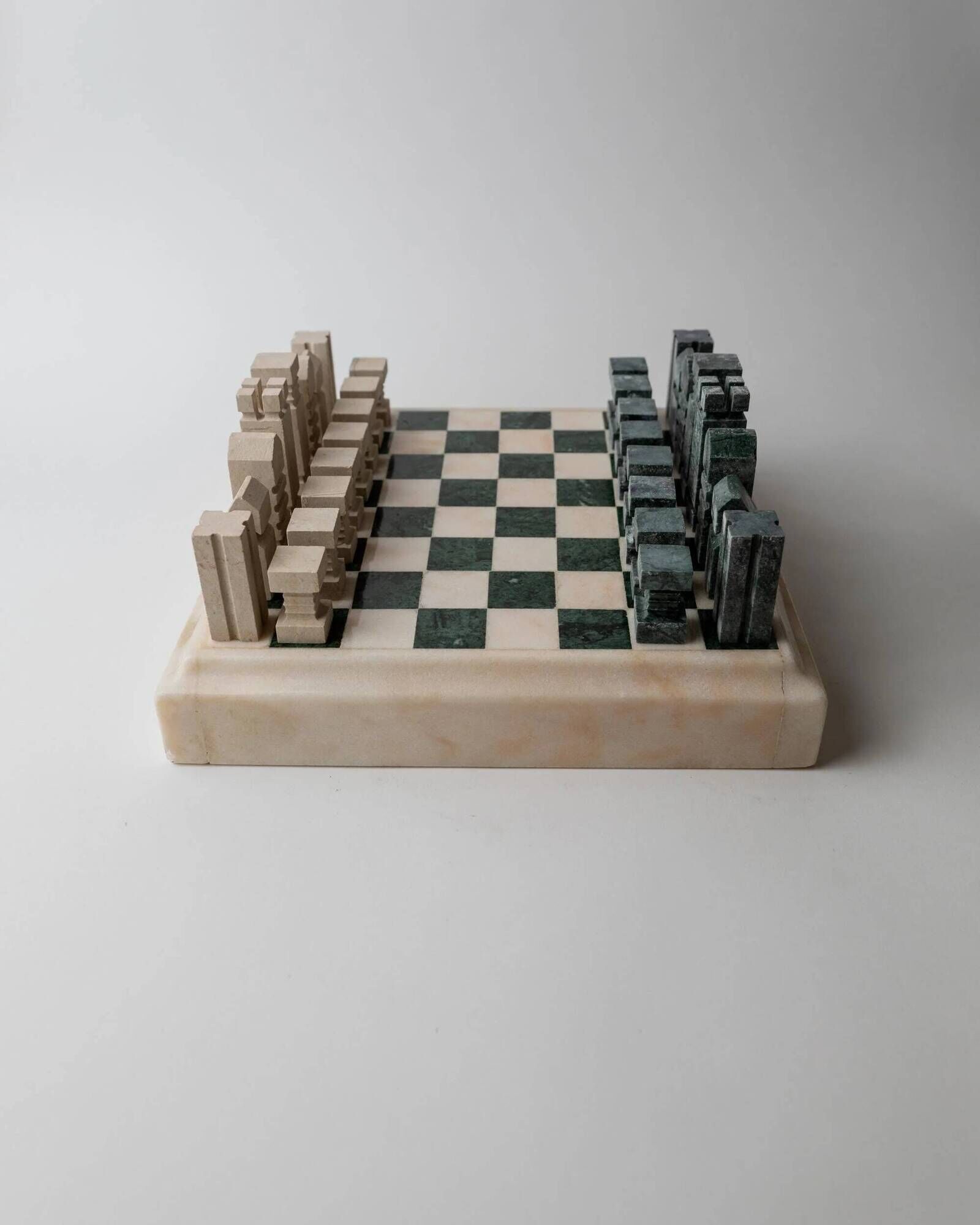 Vintage marble chess set from the 1970s, green and beige stone board, heavy design, geometric pieces, sculptural tabletop game, gift idea.