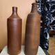 Duo of raw stoneware bottles