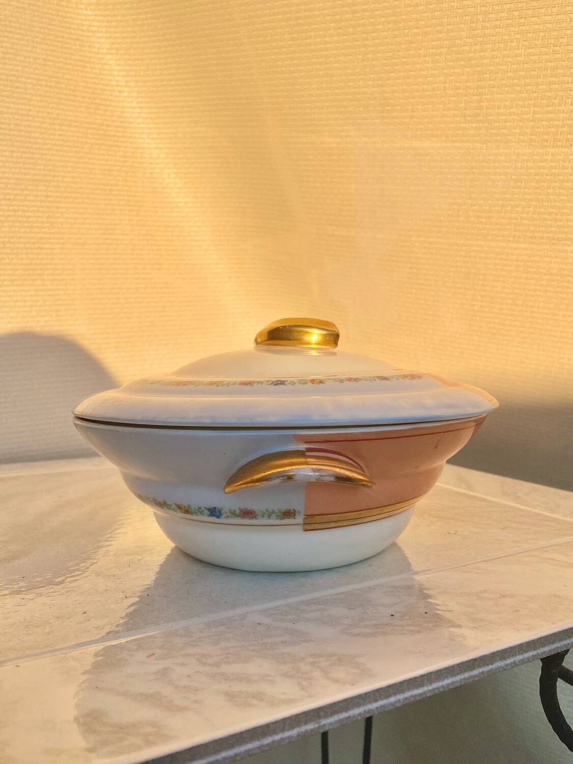 Antique Limoges porcelain soup tureen with two decorations.