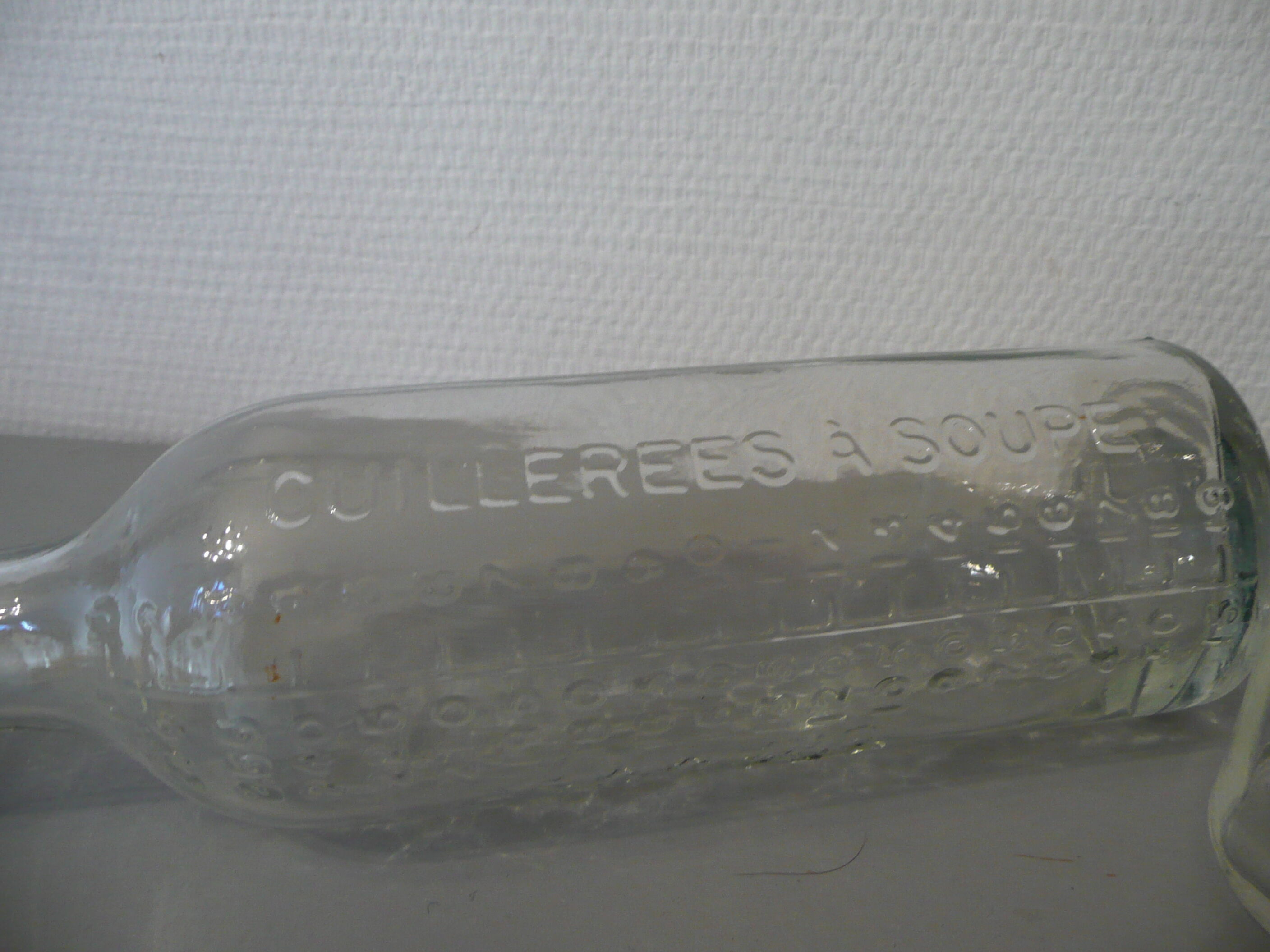 Graduated pharmaceutical bottles