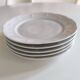 Set of five porcelain dessert plates