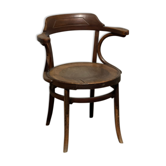 Curved wooden armchair