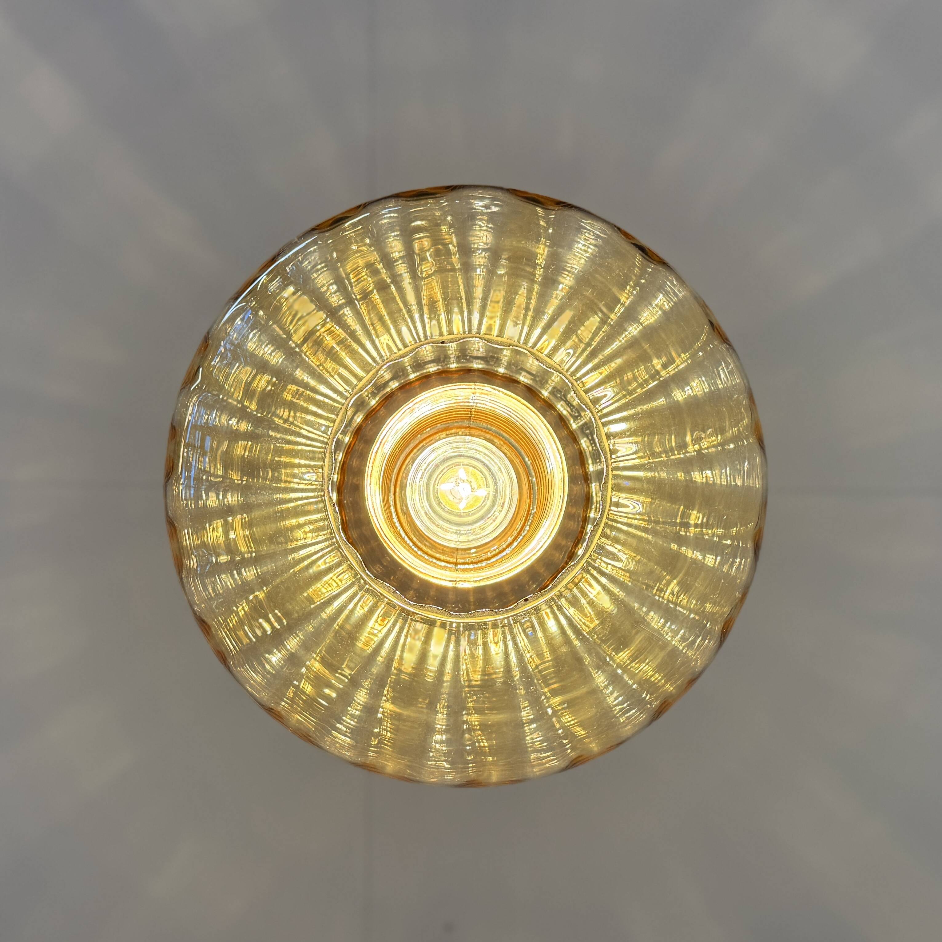 Vintage pendant lamp with amber glass shade