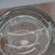 Blown glass jar with original cap