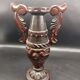 Carved wood amphora vase varnished